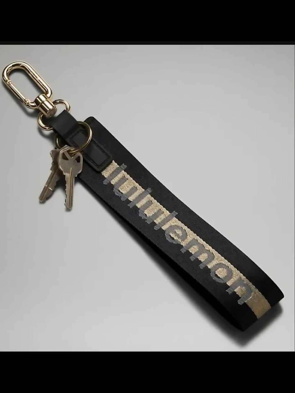 NWT lululemon athletica Black and Gold Never Lost Keychain